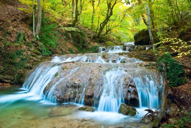 Blue river in a mountain canyon at the autumn clipart