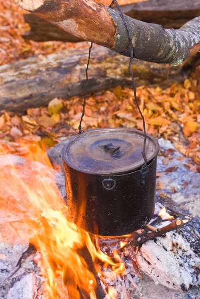 Cauldron in a fire — Stock Photo, Image