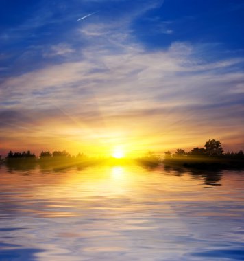 Majestic sun rising from a lake panorama clipart