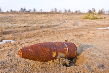 Old rusty bom in a desert clipart