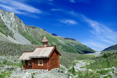 Christian church in a mountains clipart