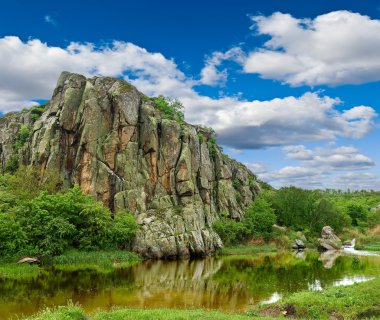 Alone rock near a lake clipart