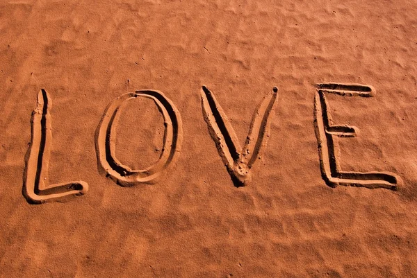 Love word on a red sand — Stock Photo, Image