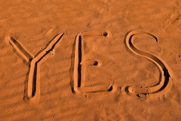 stock image Yes sign on a sand