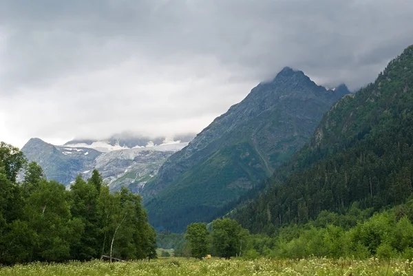 stock image Mountains in a mist and clouds