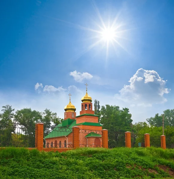 Christian church on a green hill — Stock Photo, Image