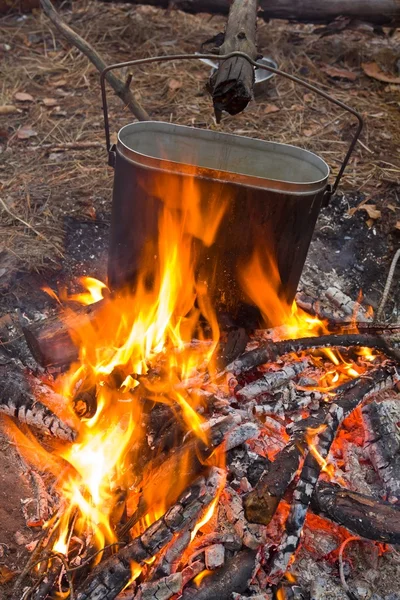 Touristic cauldron on a fire — Stock Photo, Image