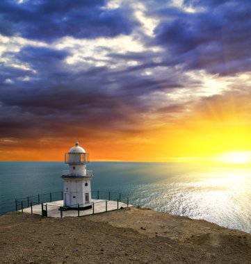Lighthouse on a sea coast clipart