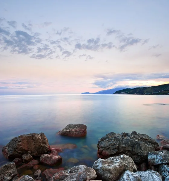 stock image Stony sea coast at the early morning