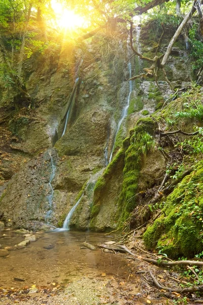 Beautiful waterfall under a sun — Stock Photo, Image