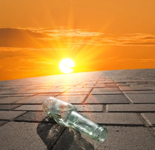 Bottle in a rays of sun — Stock Photo, Image