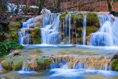 Cascades on a mountain river clipart