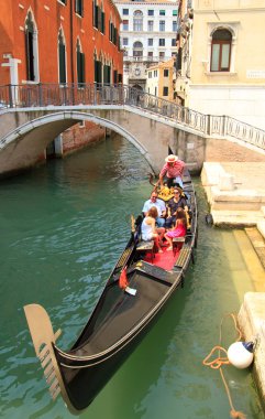 Tourists travel on gondolas clipart