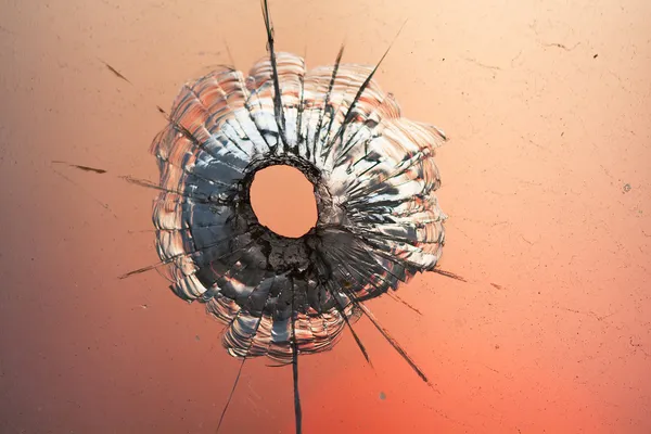 Bullet hole in glass — Stock Photo, Image