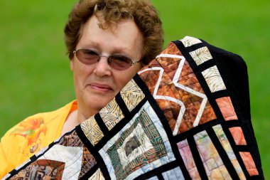 Pretty Senior Woman and her Quilt clipart