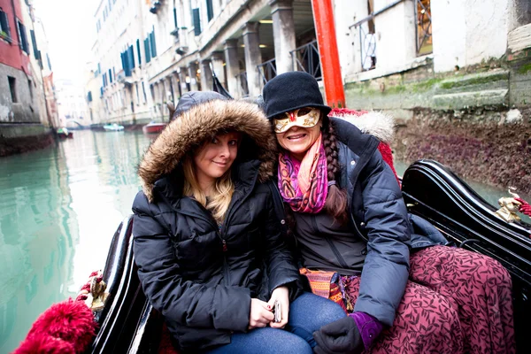 Beautifiul women riding on gondola during Carnival — Stock Photo, Image