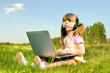 Little girl with computer clipart