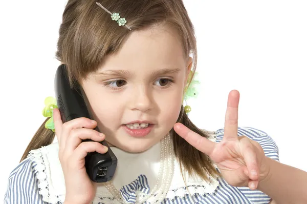 Malá dívka s telefonem — Stock fotografie