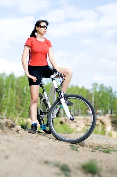 Beautiful woman bicyclist — Stock Photo, Image