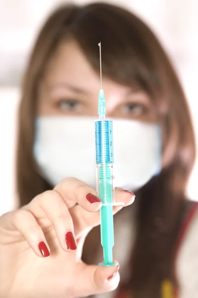 Girl with syringe — Stock Photo, Image