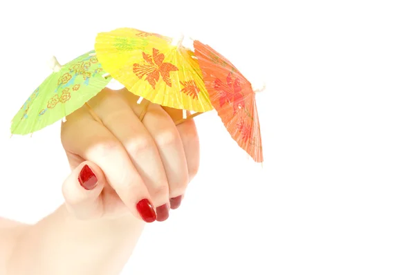 Mão e guarda-chuvas para um coquetel — Fotografia de Stock