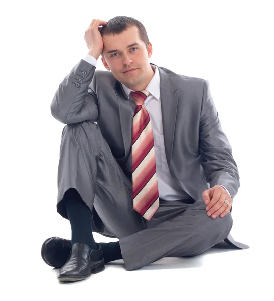 Retrato de homem de negócios sentado no chão — Fotografia de Stock