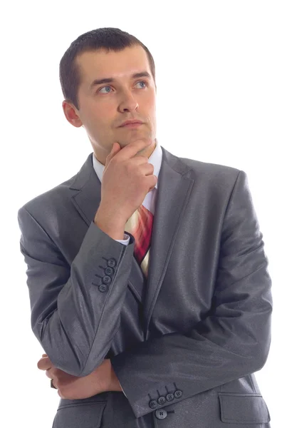 Closeup of a handsome young business man thinking about — Stock Photo, Image