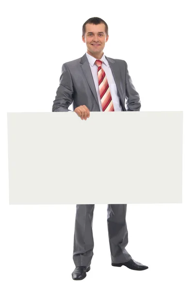 Happy smiling young business man showing blank signboard — Stock Photo, Image