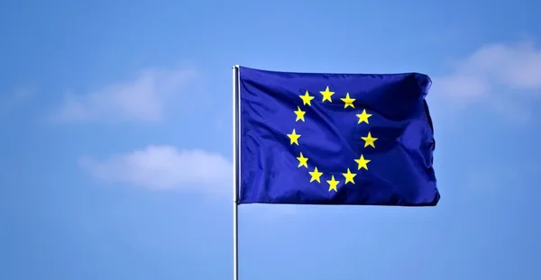 stock image EU flag against the blue sky