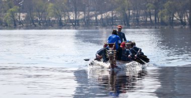 Kiev, UKRAINE - May 24: Dragon boat race for the cup of the city clipart