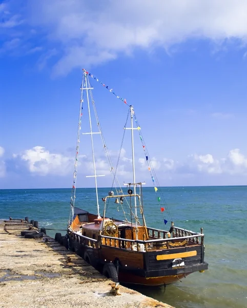 stock image Wooden retro boat in a sea