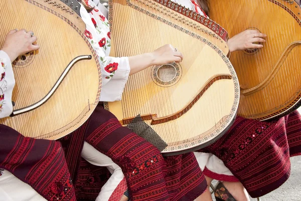 Ukraine girls play a musical stringed instrument — Stock Photo, Image