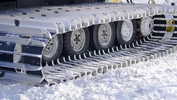 Snow-clearing equipment on a snowy background