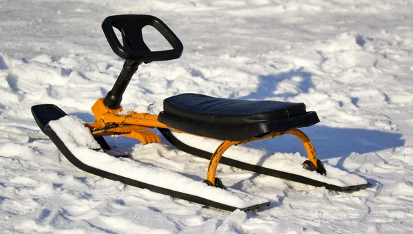 Child's sled in the snow on snow background — Stock Photo, Image