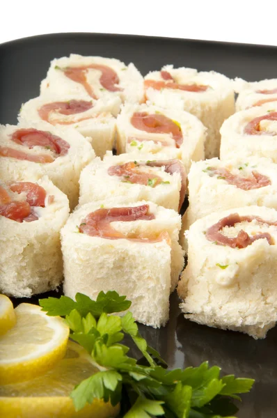 Smoked salmon rolls on white background — Stock Photo, Image