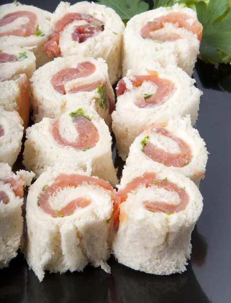 Smoked salmon rolls on white background — Stock Photo, Image