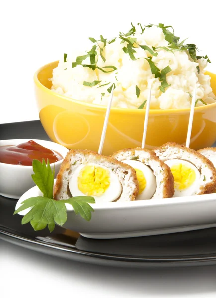 Meatballs with quail eggs and potatoes — Stock Photo, Image