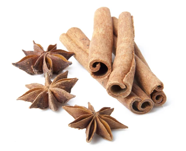Cinnamon sticks and anise stars close-up on white background — Stock Photo, Image