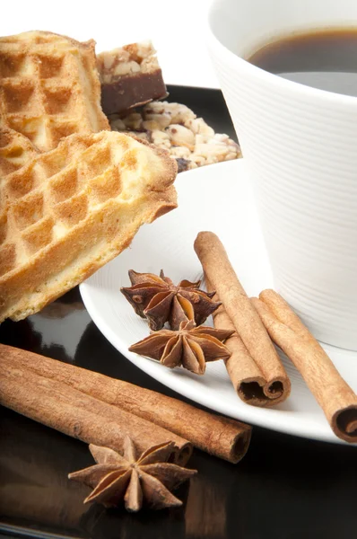Aromatic cup of coffee, cinnamon, anise and cookie — Stock Photo, Image