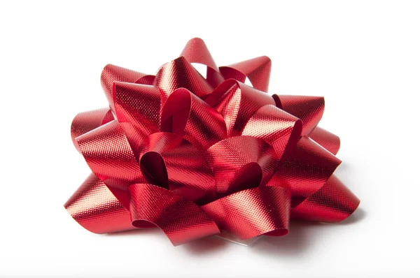 Single red ribbon gift bow isolated on white — Stock Photo, Image