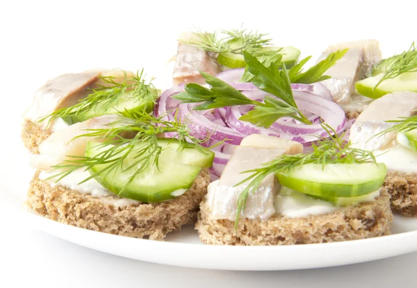 Sandwiches with herring, cucumber and dill — Stock Photo, Image