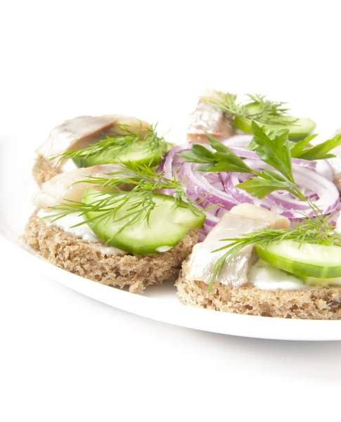 Sandwiches with herring, cucumber and dill — Stock Photo, Image