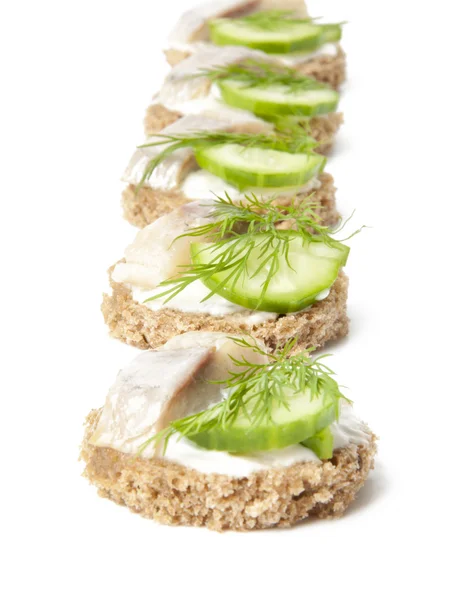 Stock image Sandwiches with herring, cucumber and dill