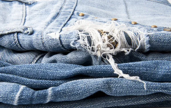stock image Torn old blue jeans background
