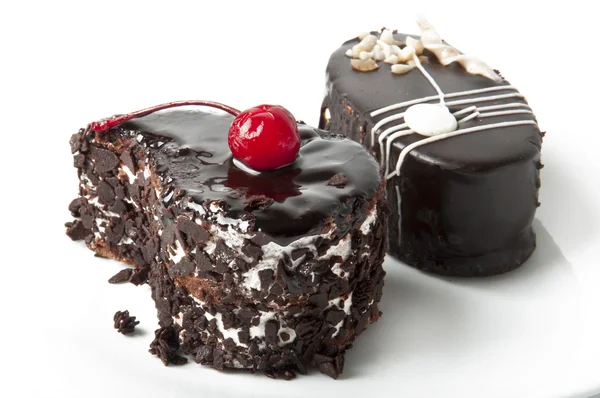 Sweet dessert fruitcake with a cherry — Stock Photo, Image