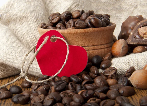Coffee grains, wood nut and chocolate — Stock Photo, Image