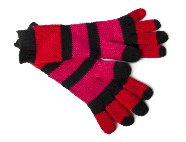 Полосатая красная пара перчаток на белом фоне — стоковое фото