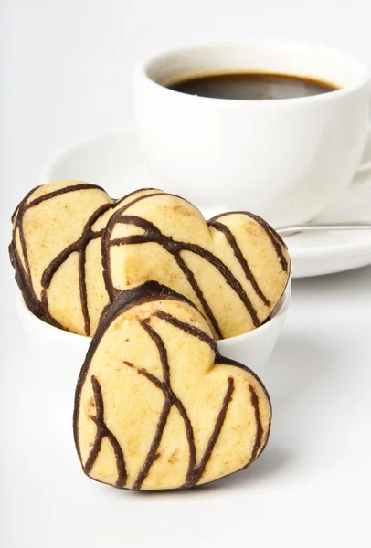 Чашка кави та печива з шоколадом — стокове фото