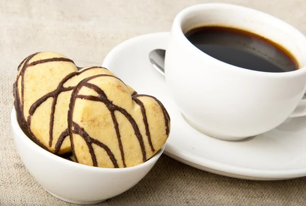 Cup of coffee and cookies with chocolate — Stock Photo, Image
