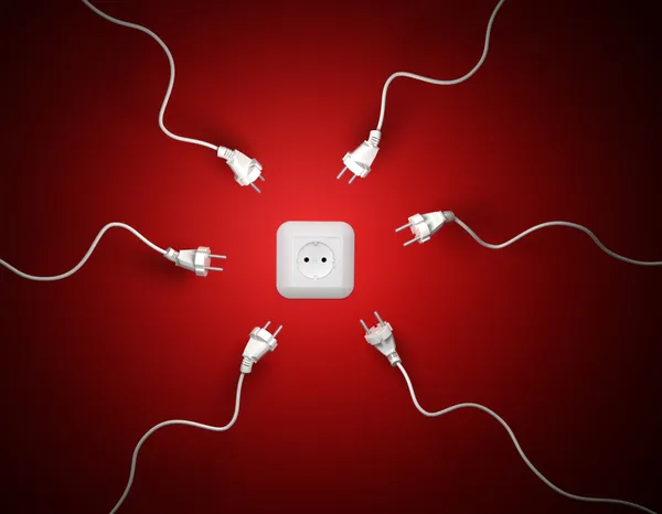 Sperm-like power cords attracted by a wall socket — Stock Photo, Image